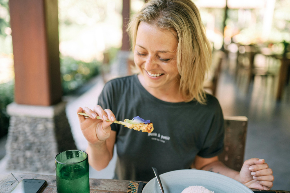 Here’s a somatic practice for reconnecting with nourishment: The next time you eat, try slowing down for just one minute before your first bite.